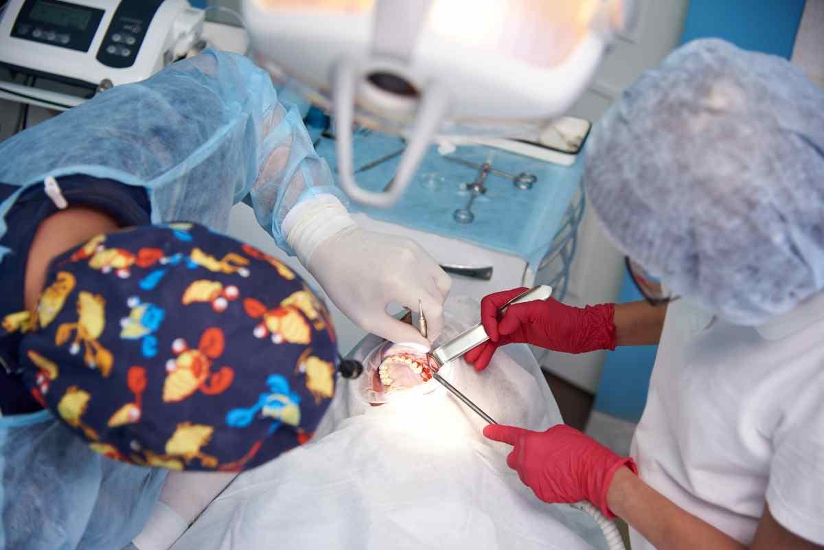 Dental surgery with two doctors and a patient